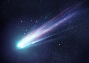 A bright comet with large dust and gas trails as the comets orbit brings it close to the Sun. Illustration.