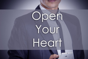 72840048 - open your heart - young businessman with text - business concept - horizontal image